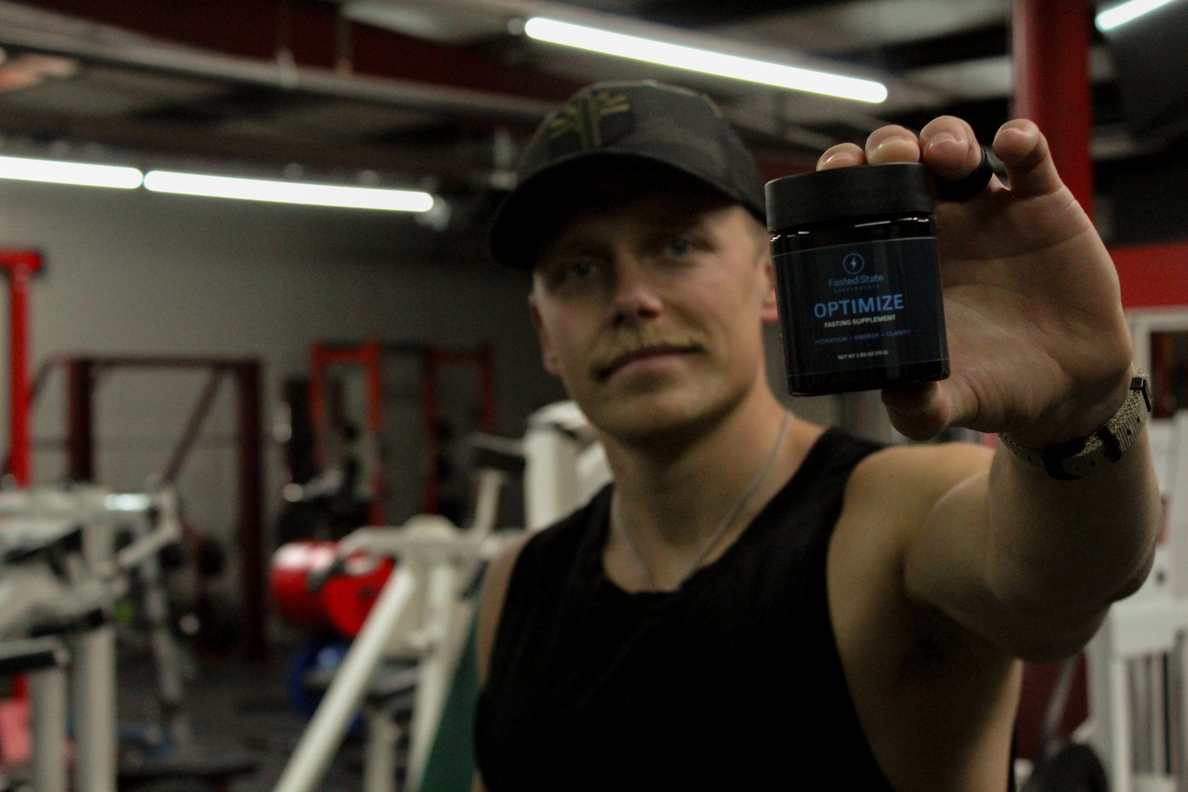A man holding a container of zero calorie electrolytes